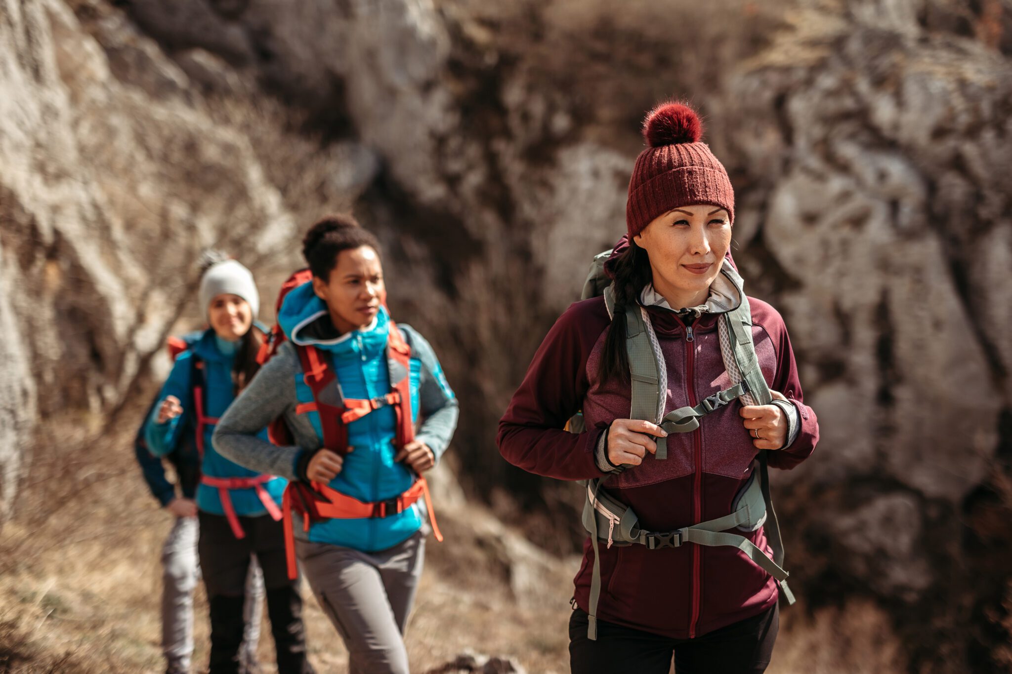 Group of tourist on hiking tour walking in nature