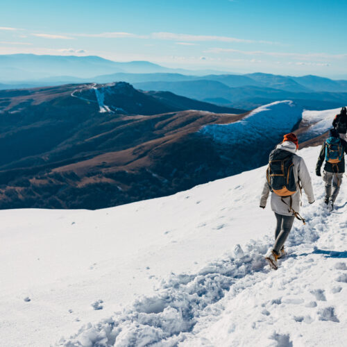 Two people hiking on a mountain