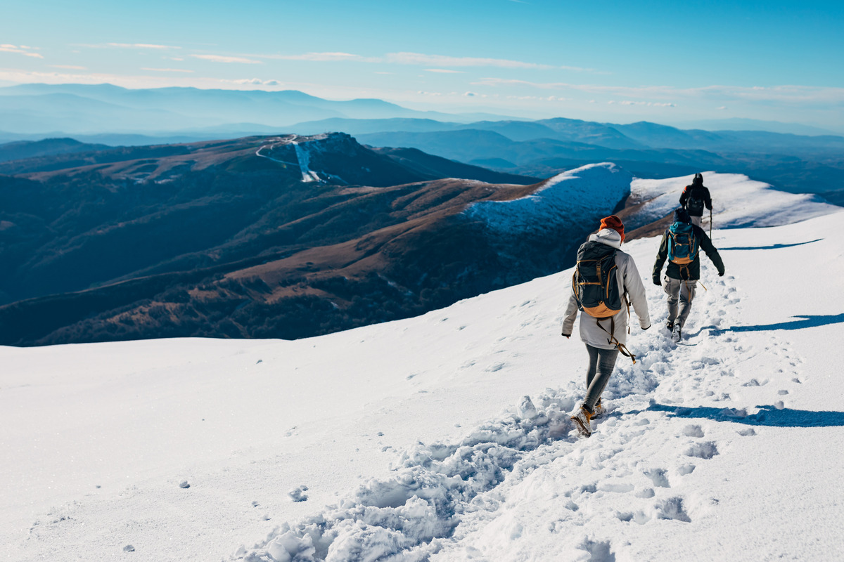 Two people hiking on a mountain